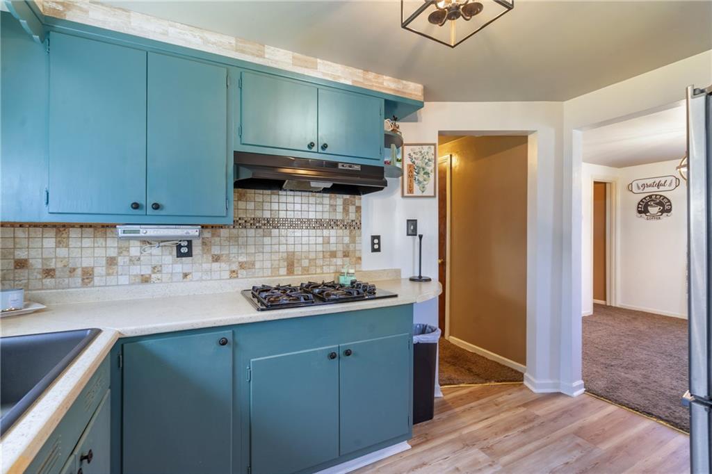 309 Clever Avenue McKees Rocks, PA 15136 - Photo 11 of 32 a kitchen with stainless steel appliances granite countertop a sink and cabinets