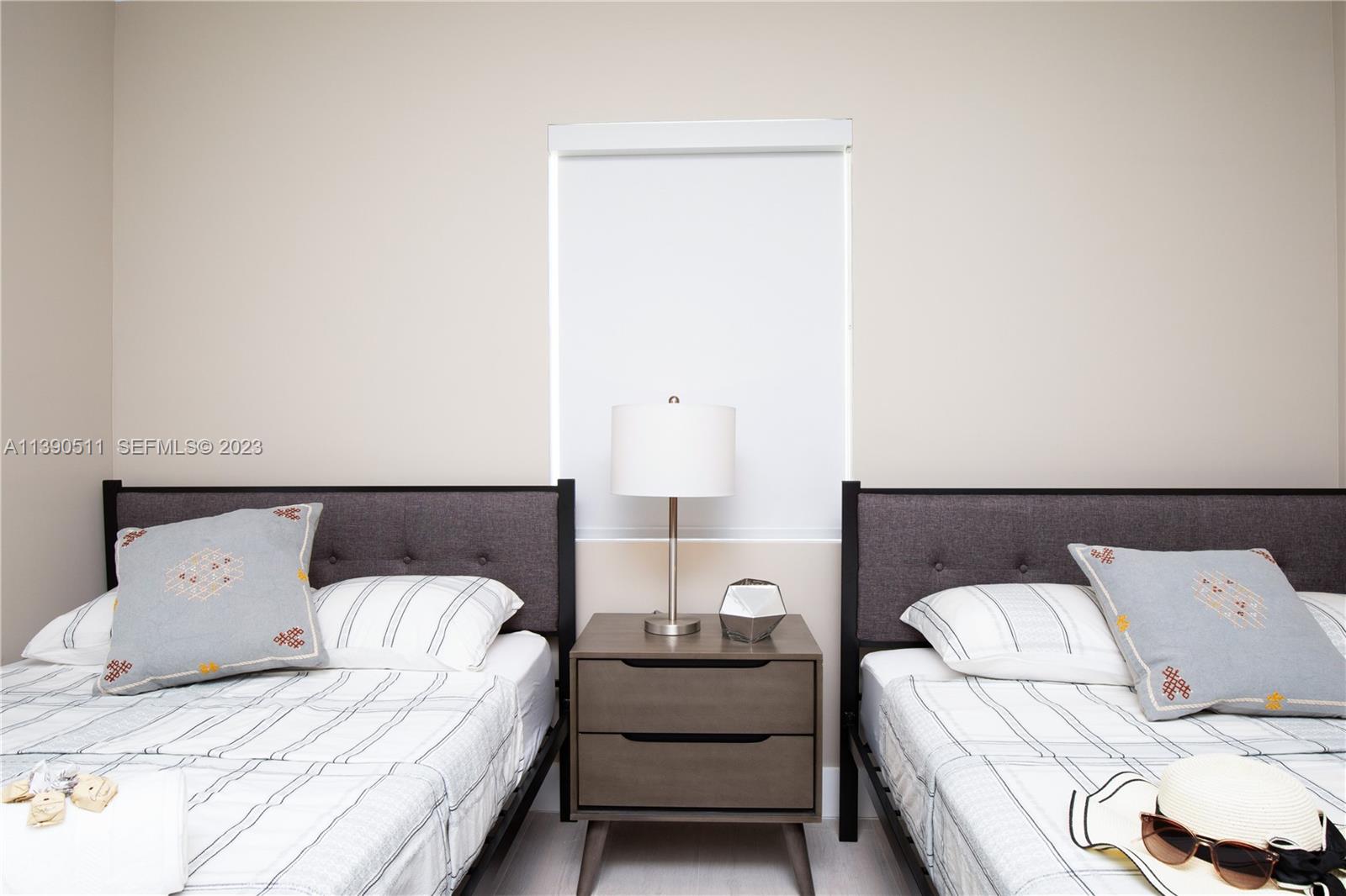 6428 Southwest 23rd Street, Unit 6428 Miami, FL 33155 - Photo 11 of 35 a bedroom with a bed and a couch