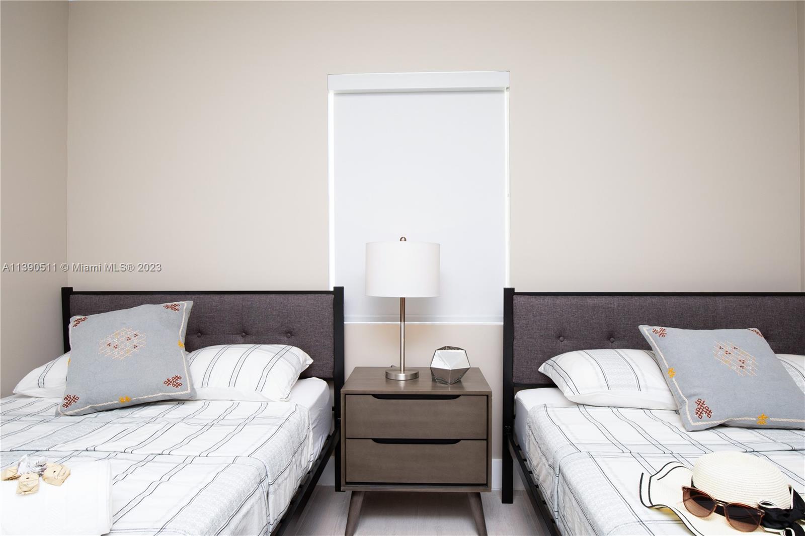 6428 Southwest 23rd Street, Unit 6428 Miami, FL 33155 - Photo 11 of 35 a bedroom with a bed and a couch