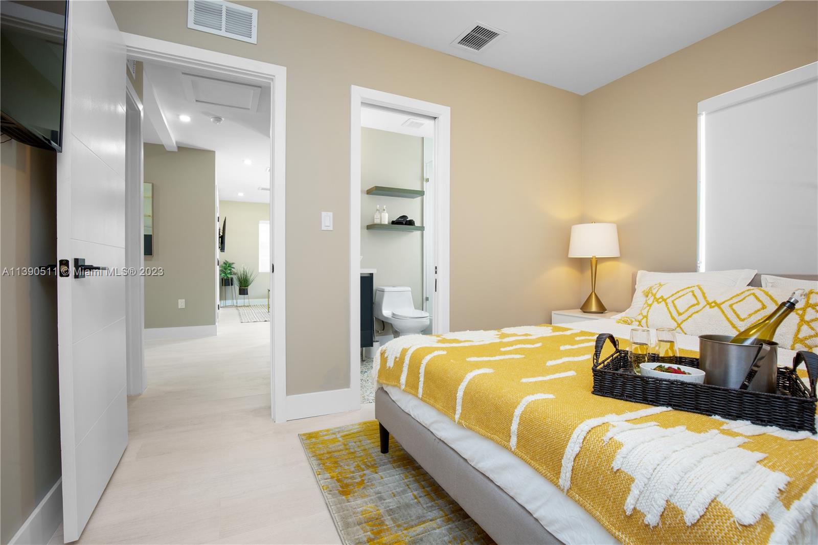 6428 Southwest 23rd Street, Unit 6428 Miami, FL 33155 - Photo 16 of 35 a bedroom with a bed and a lamp