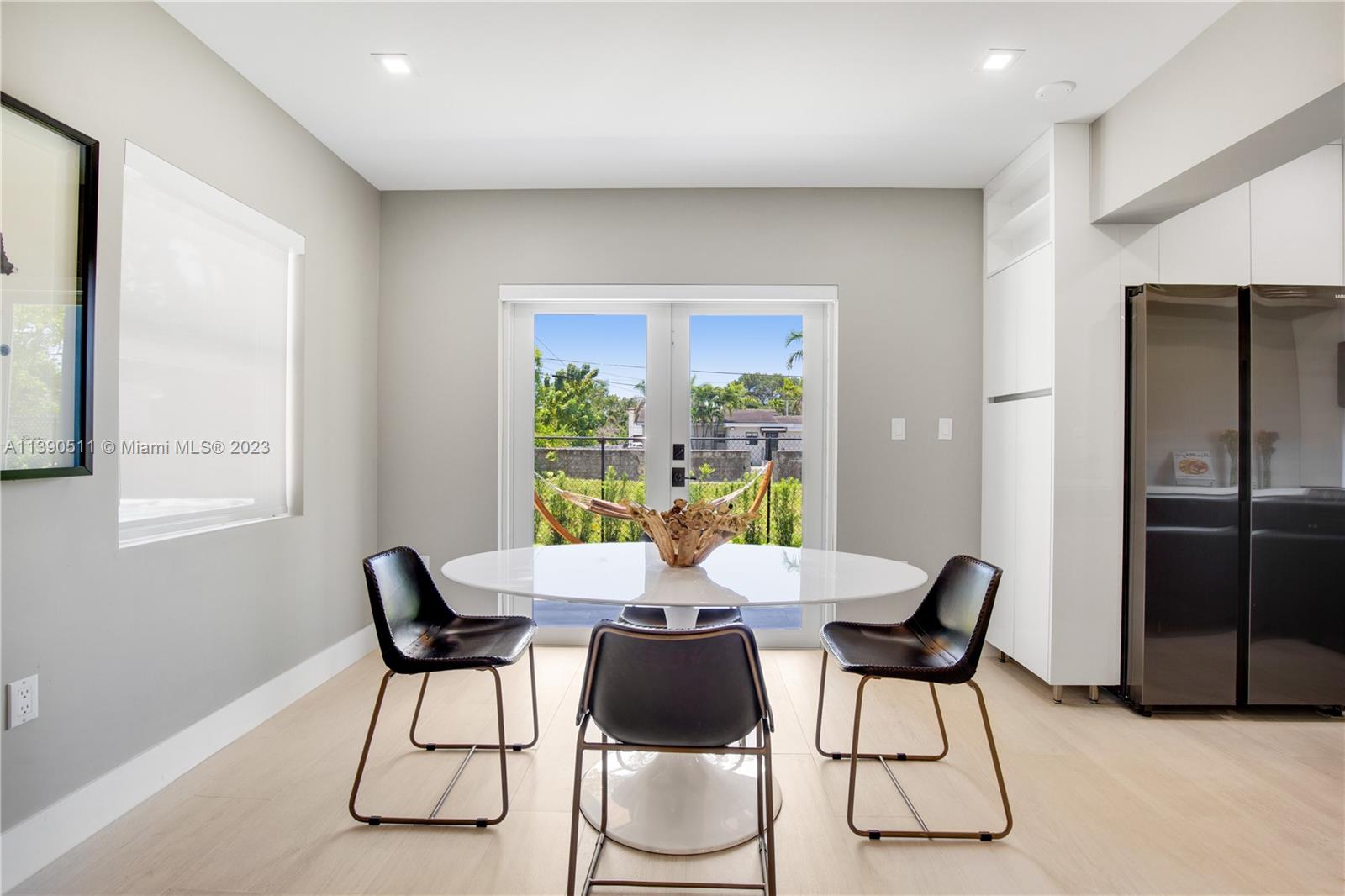 6428 Southwest 23rd Street, Unit 6428 Miami, FL 33155 - Photo 21 of 35 a view of a dining room with furniture and a window