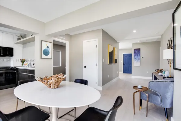 a kitchen with a sink cabinets and a window