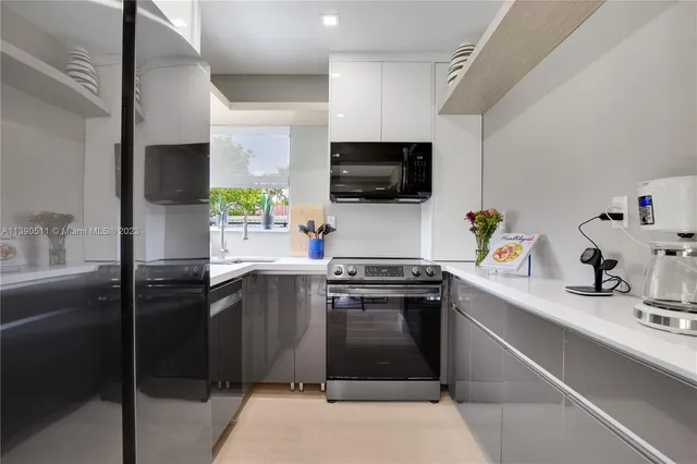 a kitchen with a sink cabinets and a window