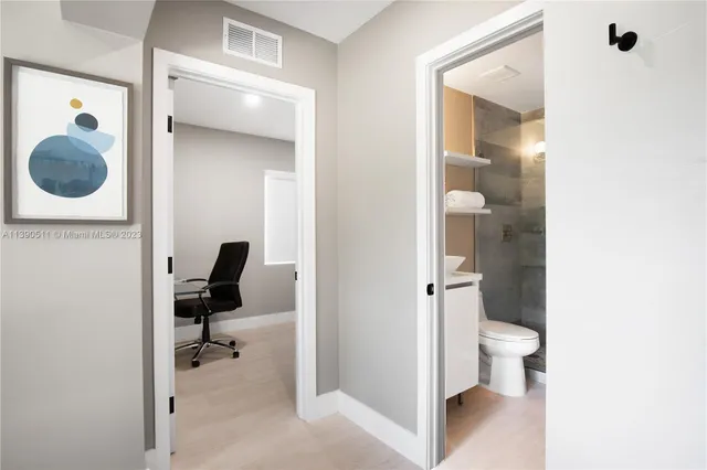 a close view of a utility room with washer and dryer