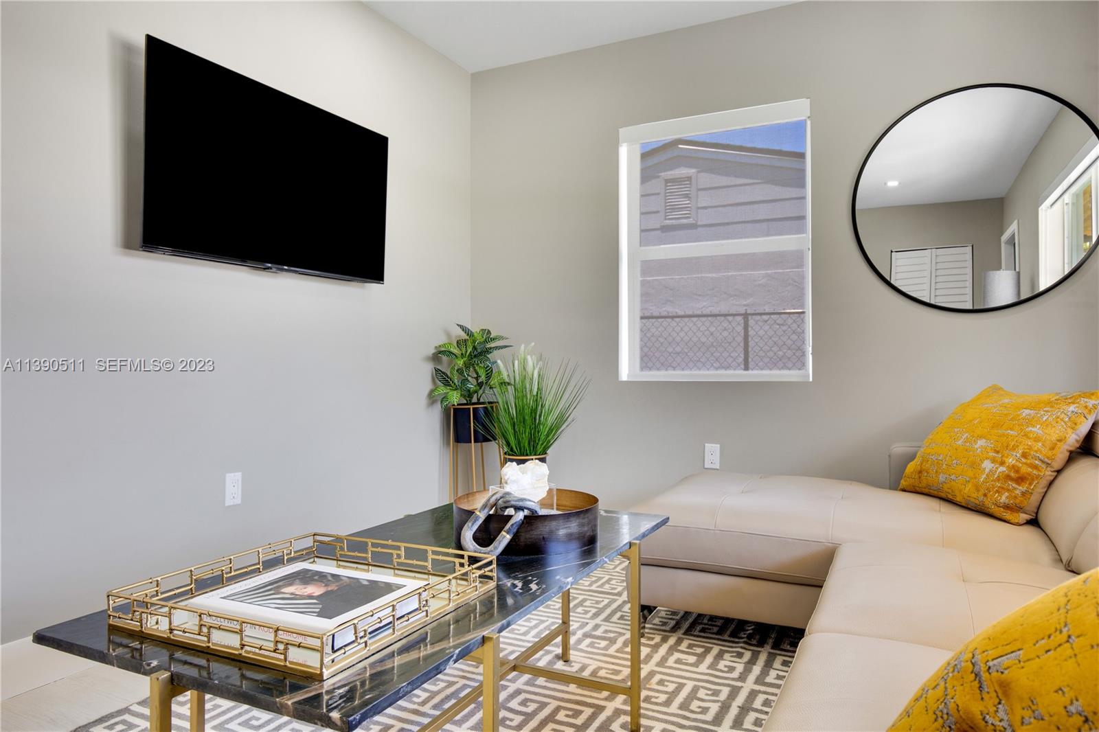 6428 Southwest 23rd Street, Unit 6428 Miami, FL 33155 - Photo 3 of 35 a living room with furniture and a flat screen tv