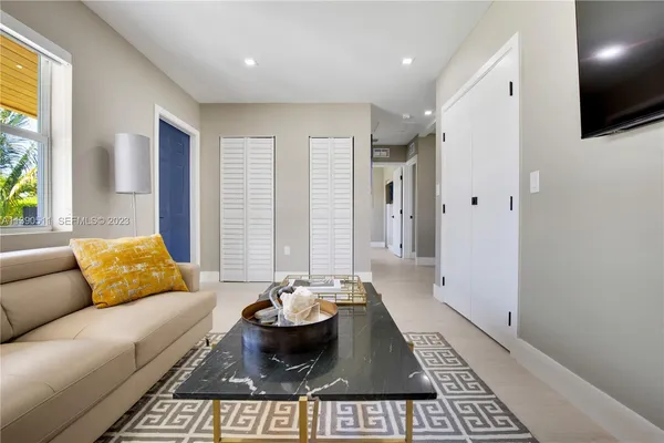 a living room with furniture and a couch