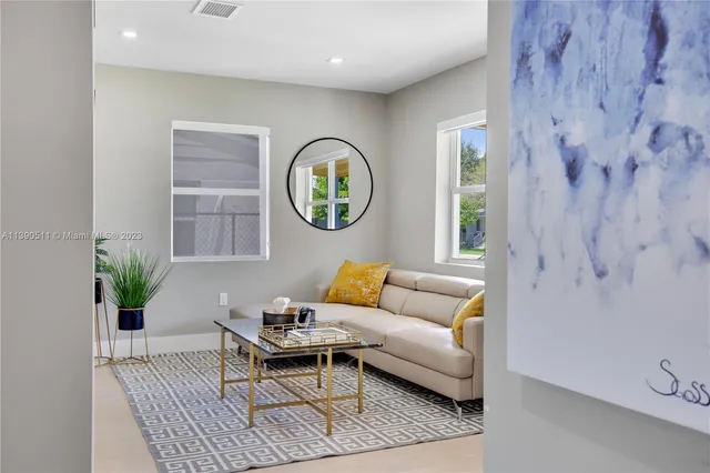 a living room with furniture and a window