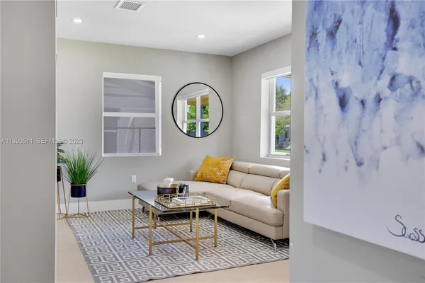 a living room with furniture and a window