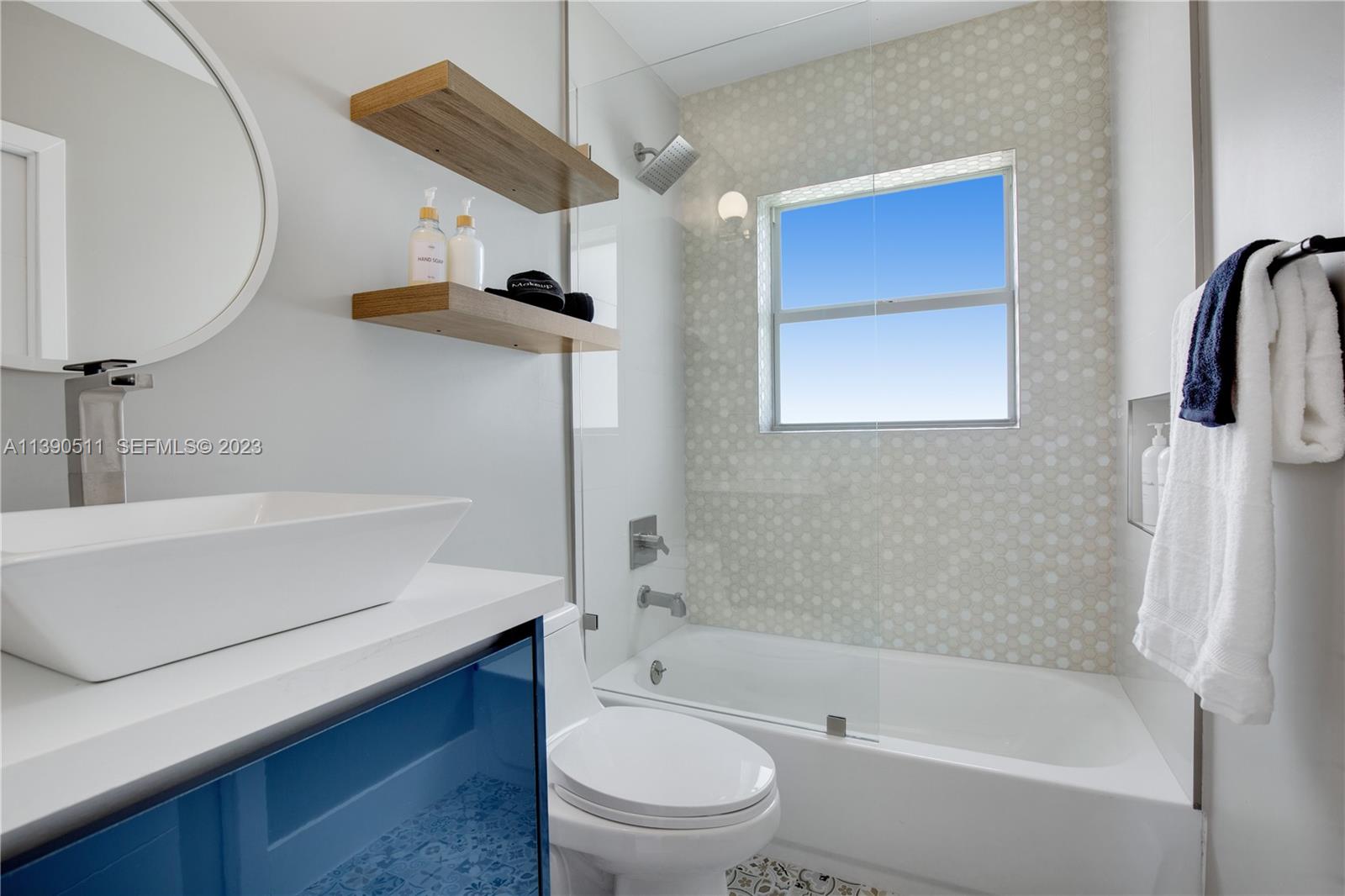 6428 Southwest 23rd Street, Unit 6428 Miami, FL 33155 - Photo 6 of 35 a bathroom with a bathtub shower sink vanity and toilet