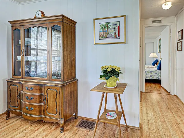 a room with furniture and flat screen tv