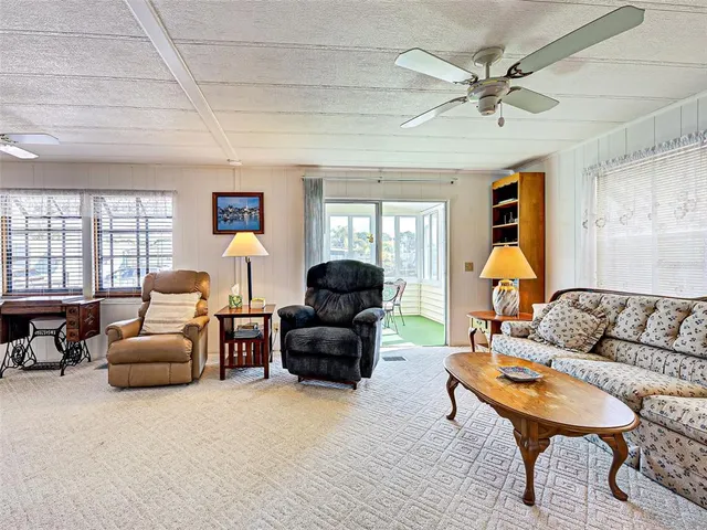 a large living room with windows