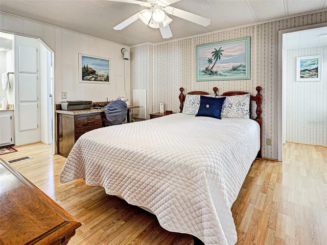 a bedroom with a bed and a lamp