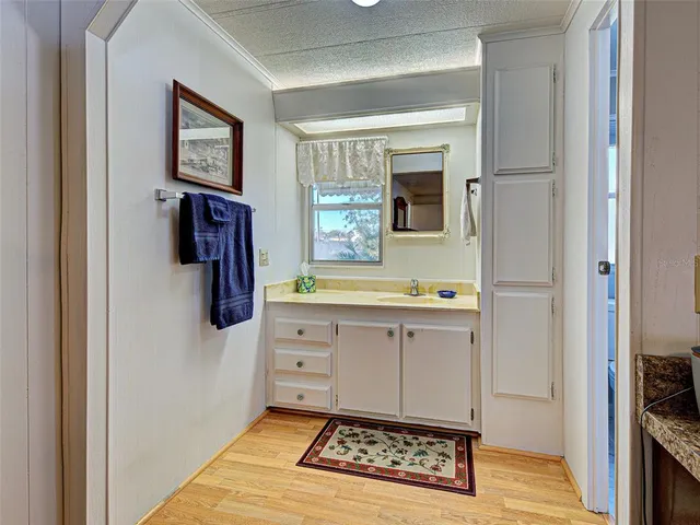 a dining room with furniture and a floor to ceiling window