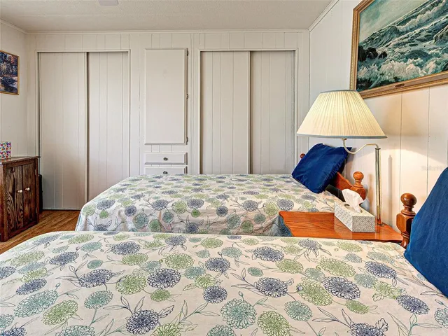 a view of a swimming pool with a patio and a garden