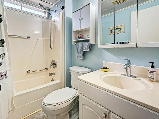 a swimming pool with outdoor seating and yard