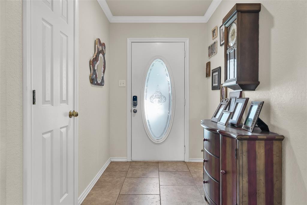 2510 Holiday Street Denison, TX 75020 - Photo 4 of 30 a view of a livingroom with wooden floor and cabinets