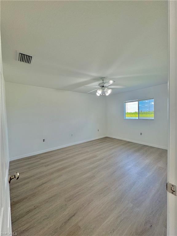 813 Naples Avenue South Lehigh Acres, FL 33974 - Photo 11 of 13 a view of a room with an empty space