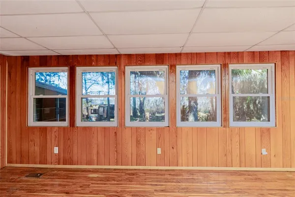 a view of a livingroom with a ceiling fan and window