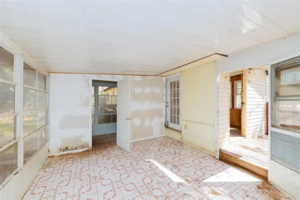 a view of an empty room and window