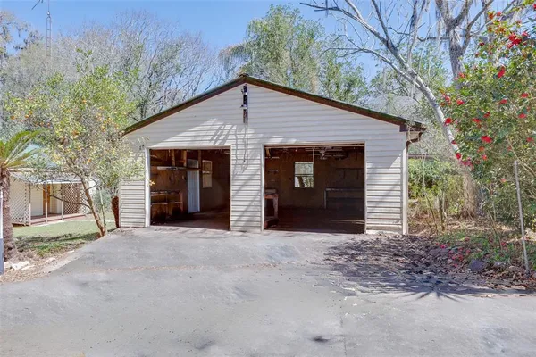 a view of a house with a yard and garage