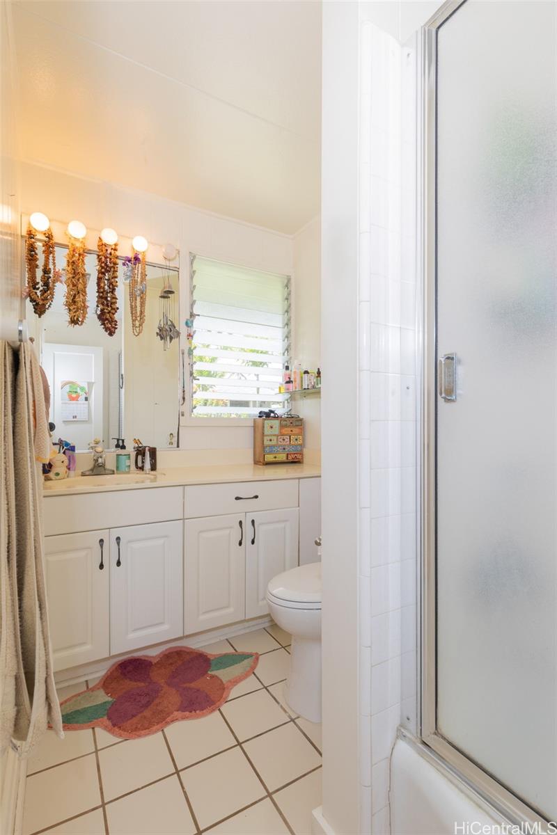 176 Kuulei Road Kailua, HI 96734 - Photo 11 of 24 One of two full bathrooms on the left wing of the home amongst the 3 bedrooms.