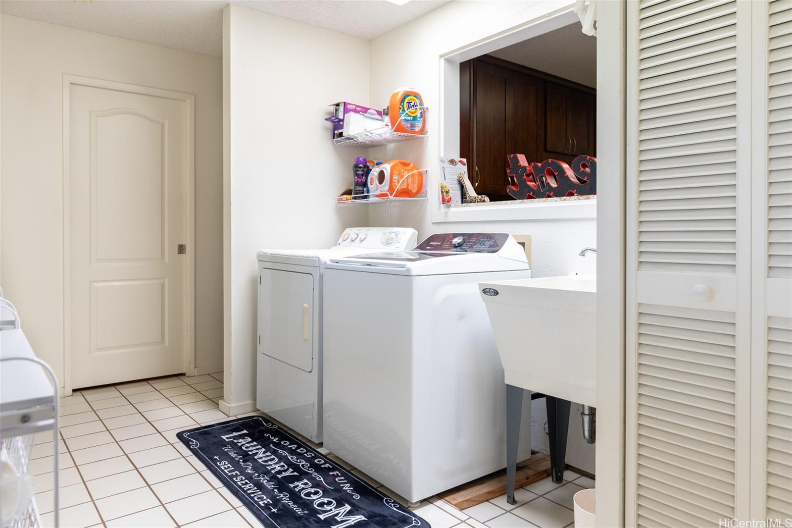 176 Kuulei Road Kailua, HI 96734 - Photo 13 of 24 Interior laundry area with full size washer and dryer.