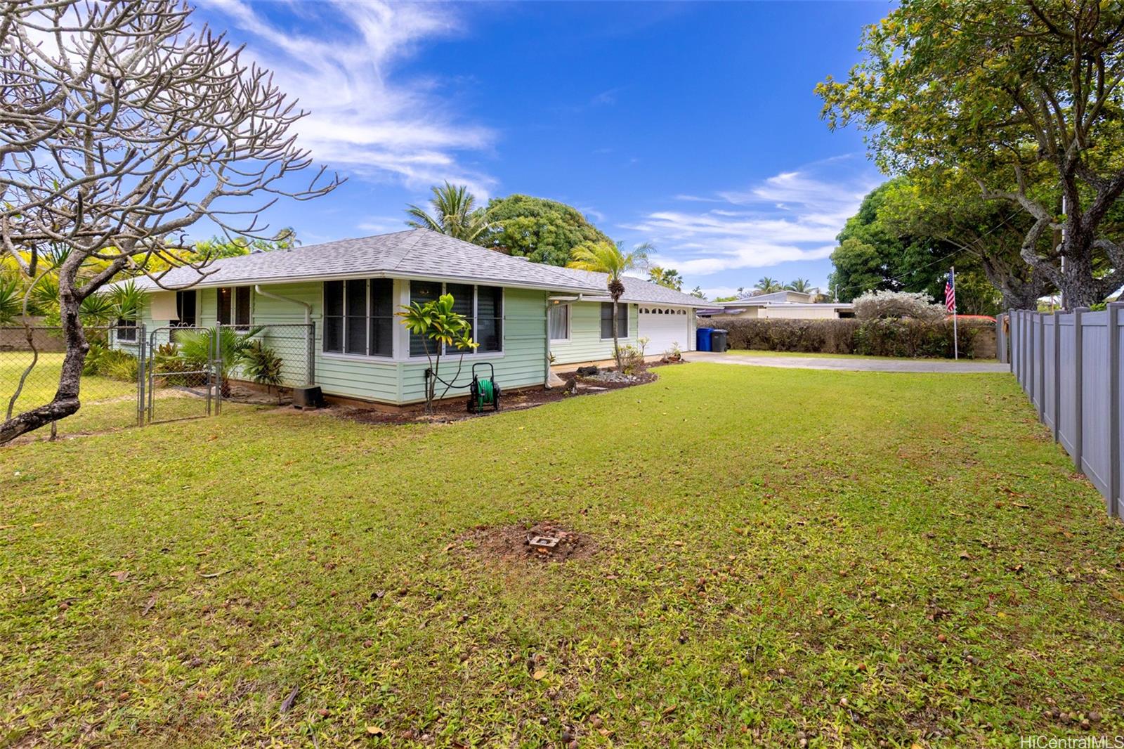 176 Kuulei Road Kailua, HI 96734 - Photo 2 of 24 Expansive front yard with the backyard enclosed on both sides for children and pets.