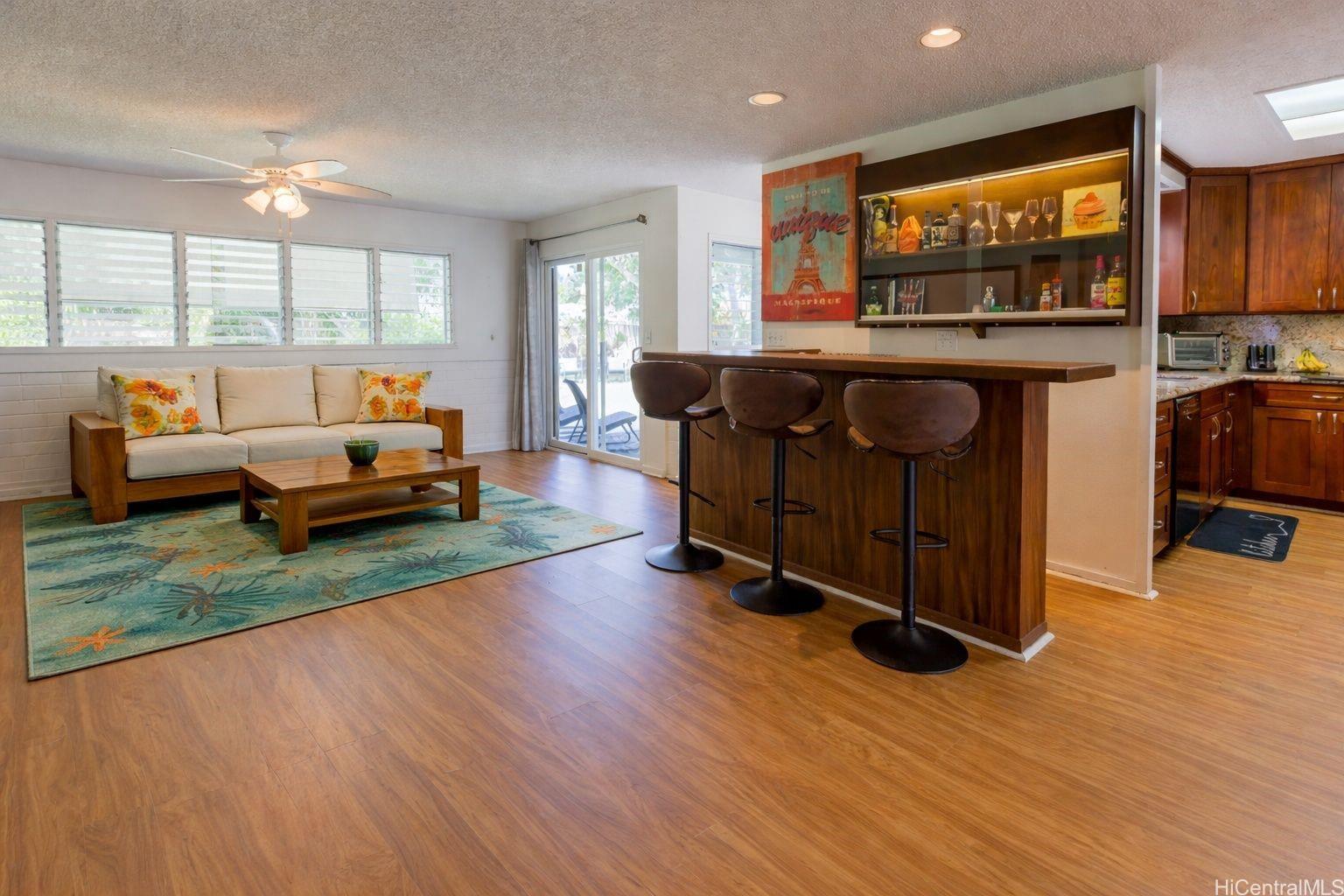 176 Kuulei Road Kailua, HI 96734 - Photo 6 of 24 Living room and bar area. The room has been virtually staged.