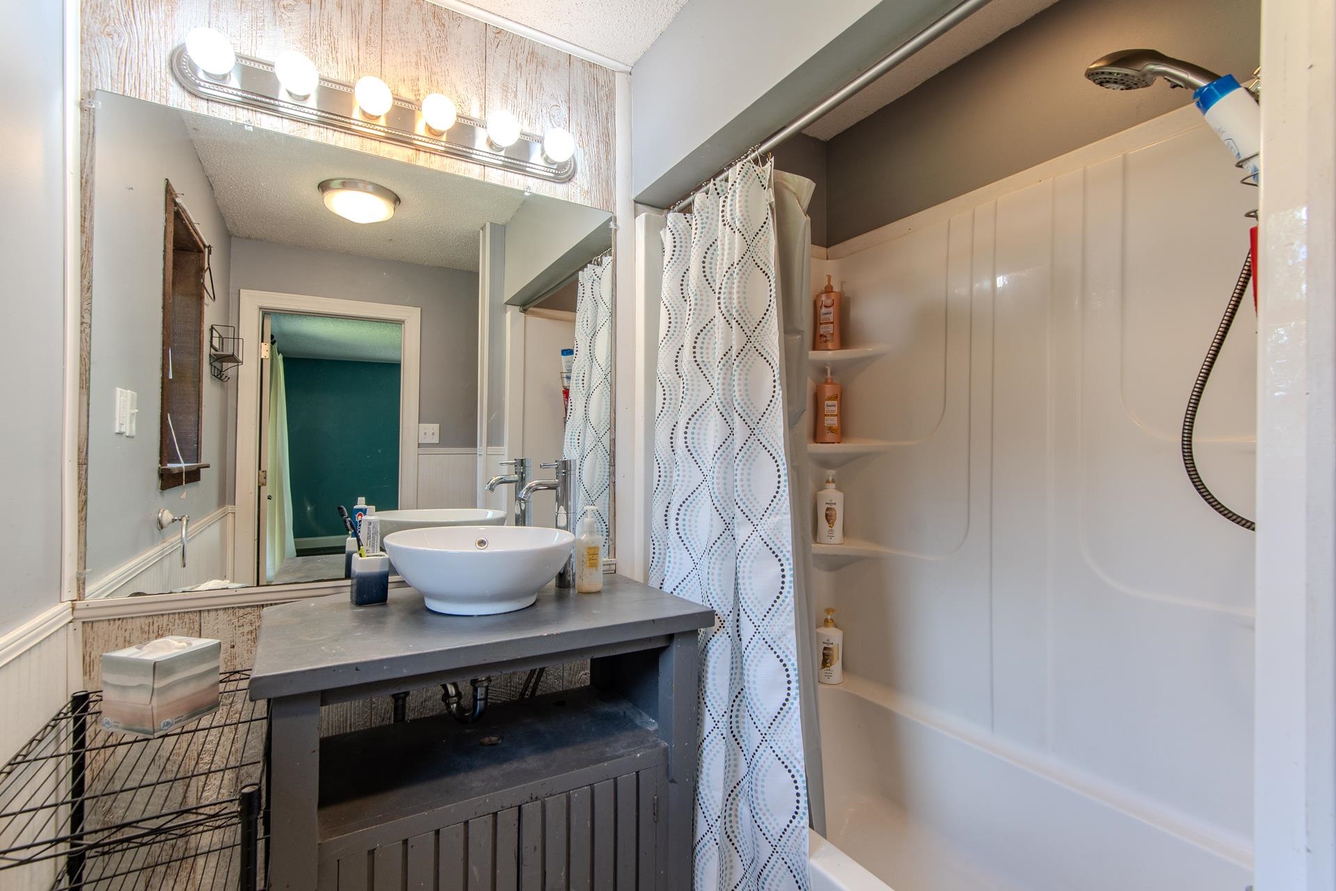 3280 Ramer Selmer Road Ramer, TN 38367 - Photo 16 of 23 a bathroom with a sink a toilet and shower