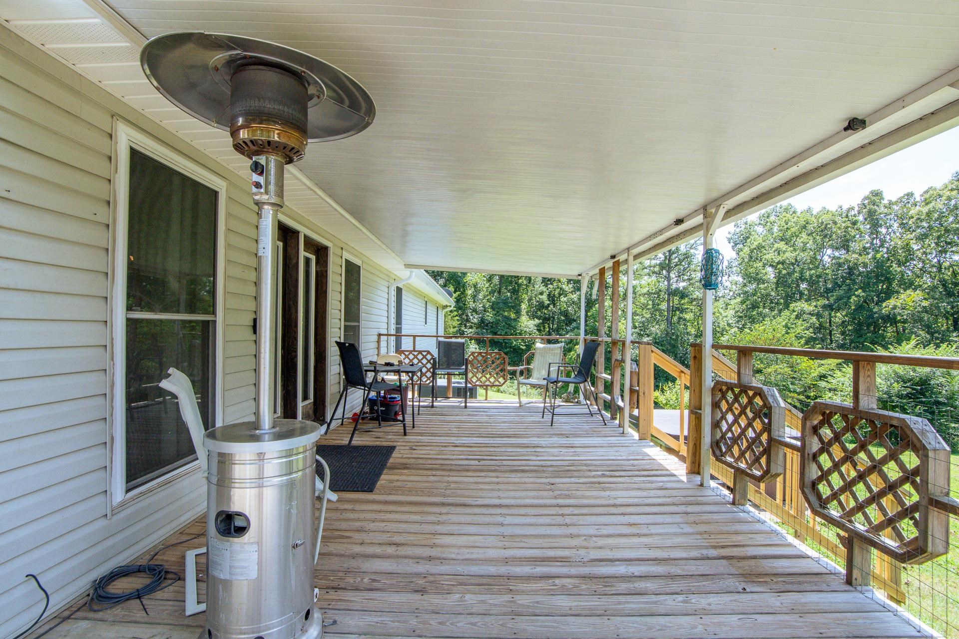 3280 Ramer Selmer Road Ramer, TN 38367 - Photo 6 of 23 a view of balcony with chairs and wooden floor