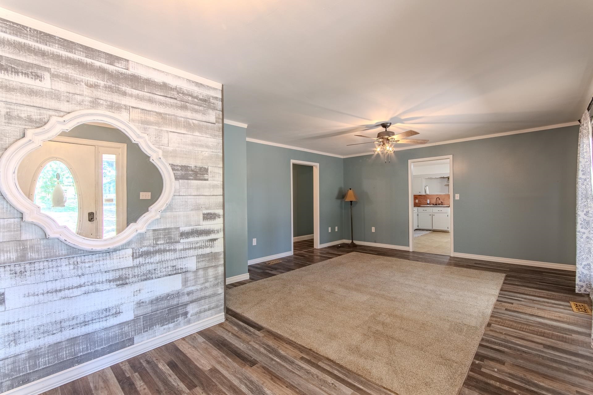 3280 Ramer Selmer Road Ramer, TN 38367 - Photo 8 of 23 an empty room with wooden floor and hallway