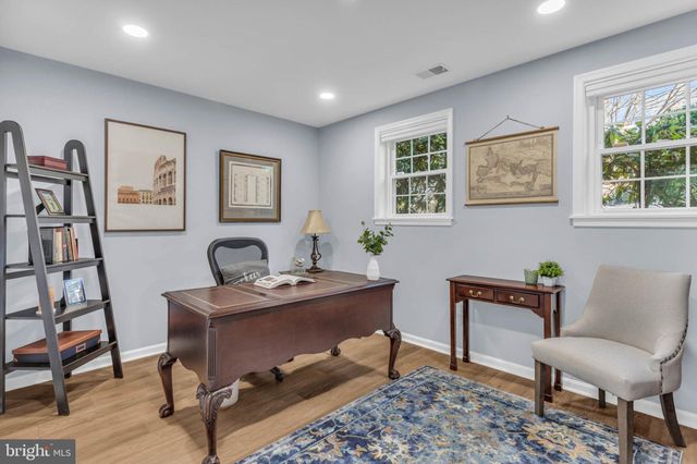 a view of a patio with a table chairs and a yard