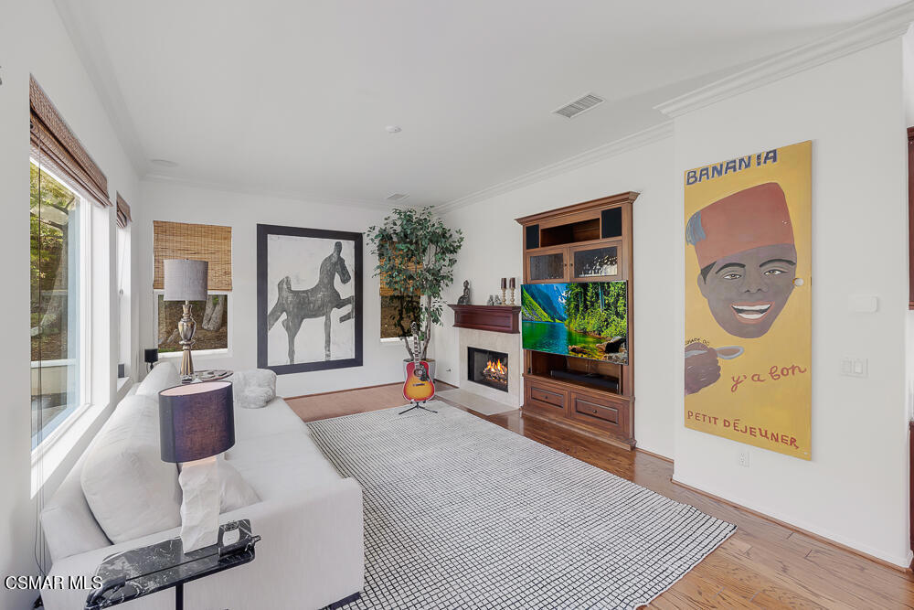 6103 Deerhill Road Oak Park, CA 91377 - Photo 14 of 40 a living room with furniture and a large window