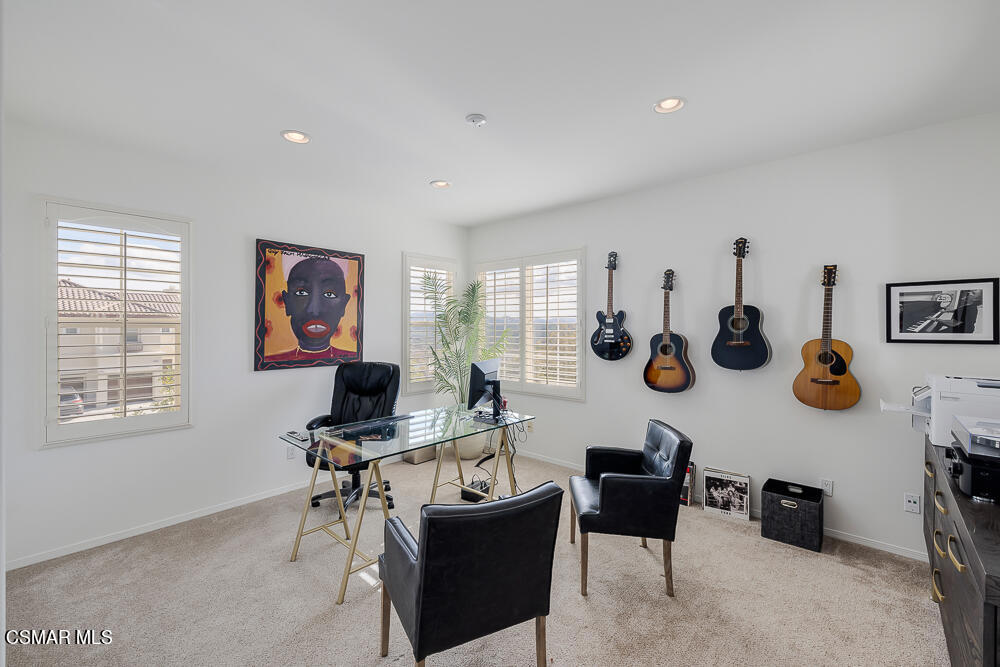 6103 Deerhill Road Oak Park, CA 91377 - Photo 23 of 40 a living room with furniture and a window