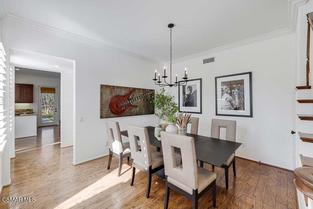 6103 Deerhill Road Oak Park, CA 91377 - Photo 10 of 40 a view of a dining room with furniture window and wooden floor