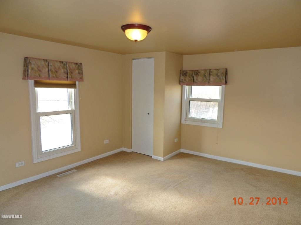 9691 Trask Bridge Road Pecatonica, IL 61063 - Photo 17 of 23 an empty room with windows
