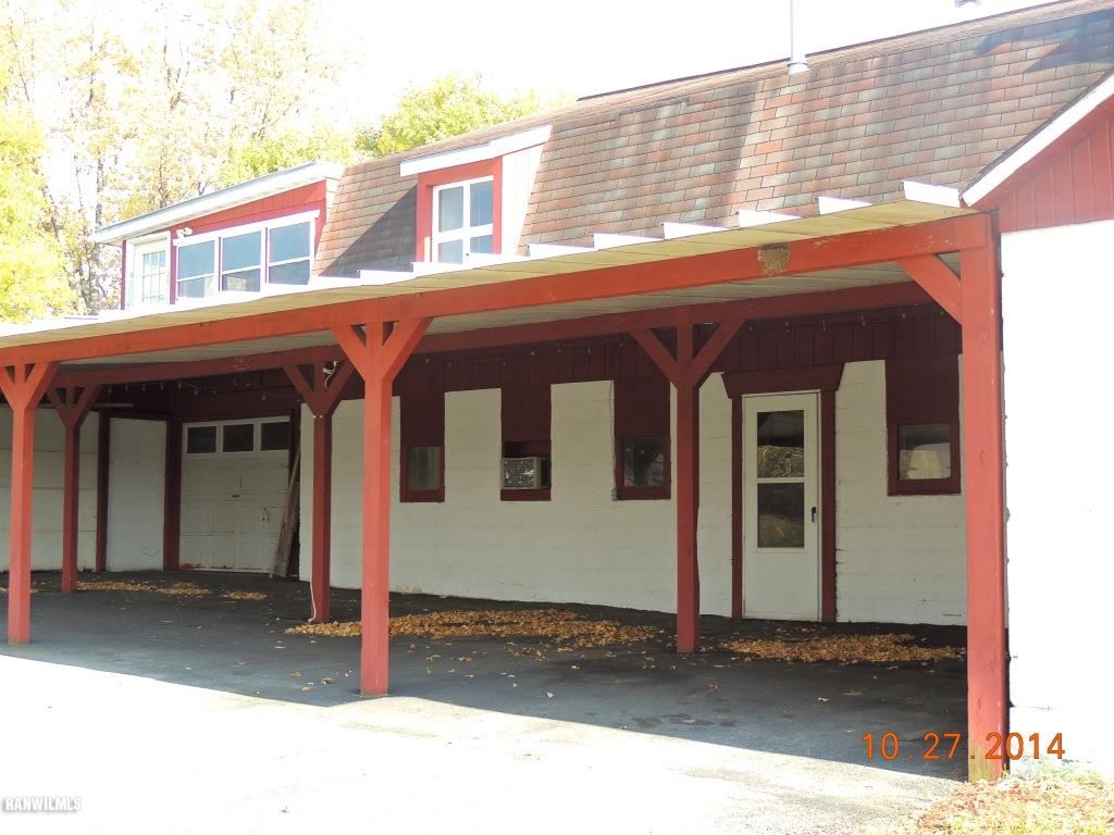 9691 Trask Bridge Road Pecatonica, IL 61063 - Photo 20 of 23 a view of a house with wooden fence