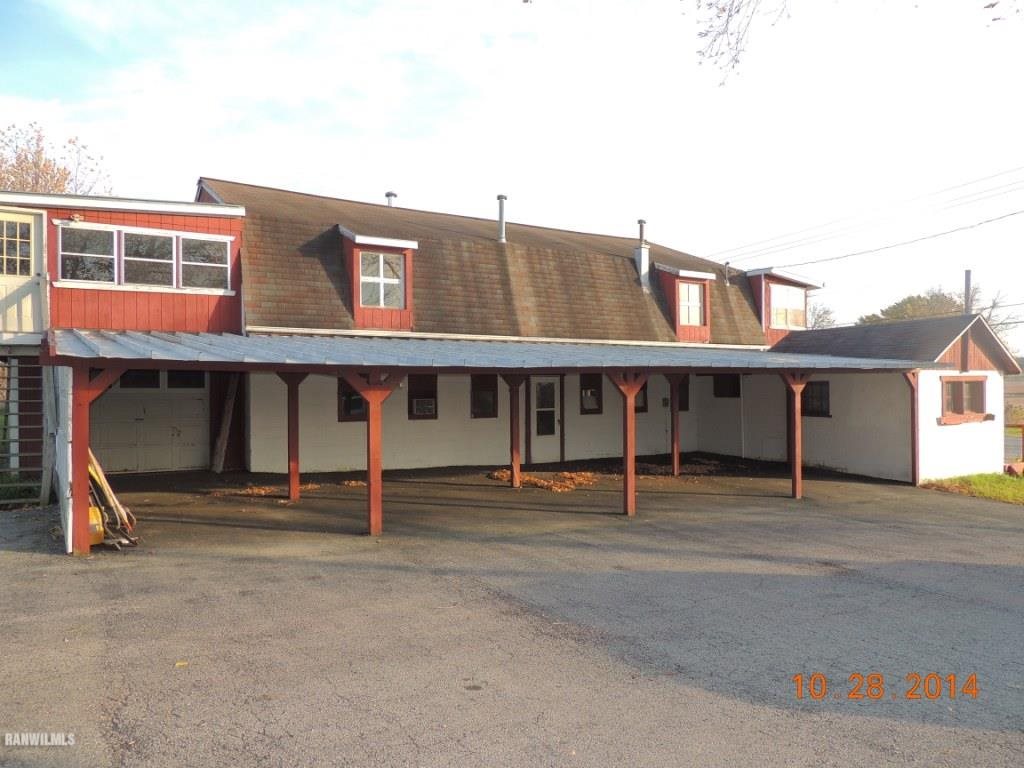 9691 Trask Bridge Road Pecatonica, IL 61063 - Photo 21 of 23 a wooden bench sitting in front of a building