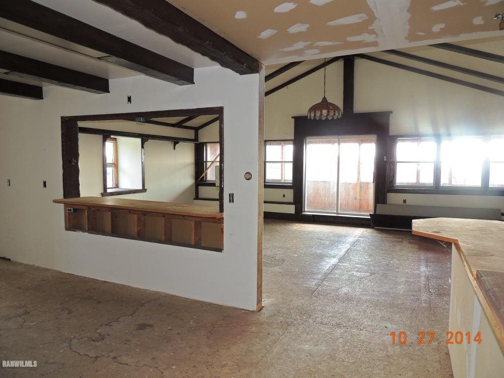 9691 Trask Bridge Road Pecatonica, IL 61063 - Photo 22 of 23 a view of a hallway with entryway and chandelier