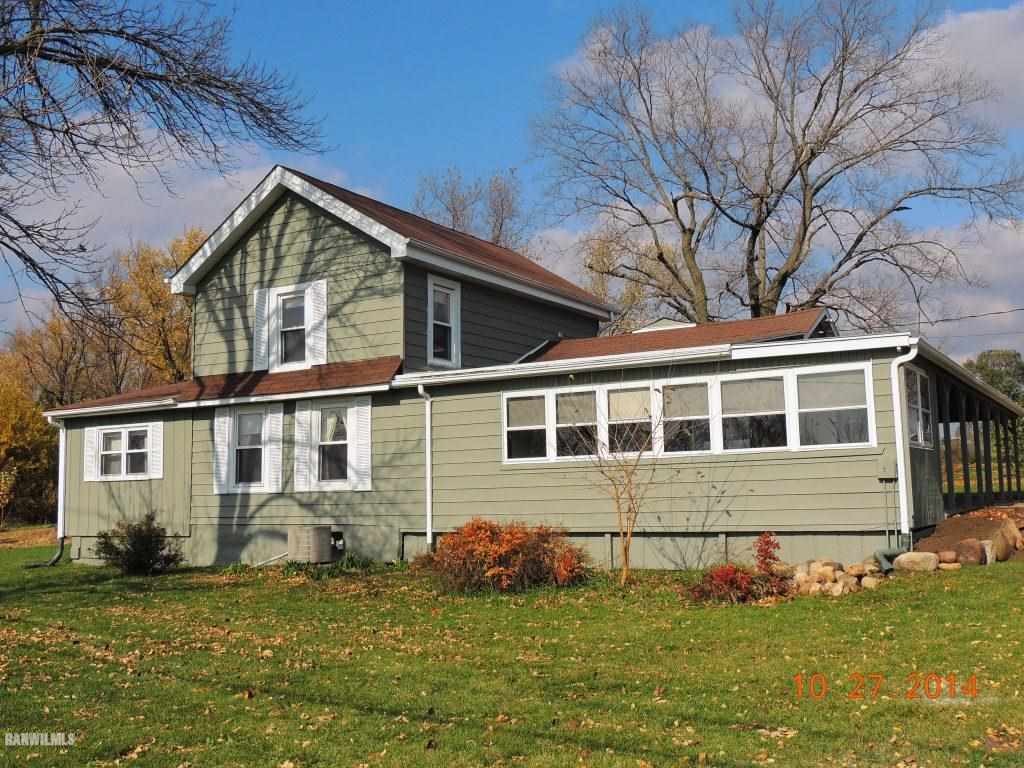 9691 Trask Bridge Road Pecatonica, IL 61063 - Photo 3 of 23 a front view of a house with a yard