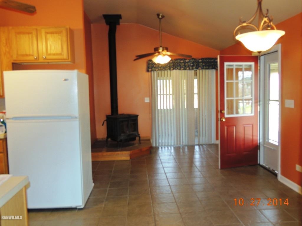 9691 Trask Bridge Road Pecatonica, IL 61063 - Photo 7 of 23 a view of a room with furniture and a chandelier