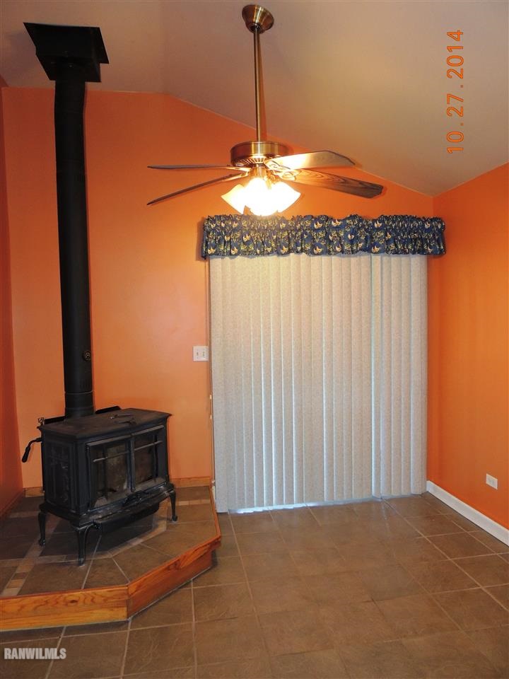 9691 Trask Bridge Road Pecatonica, IL 61063 - Photo 8 of 23 a lamp on a table in front of a door
