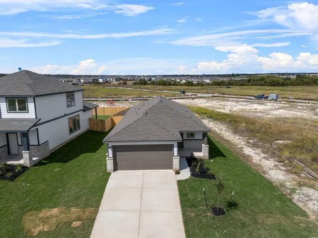 a aerial view of a house with a lake view