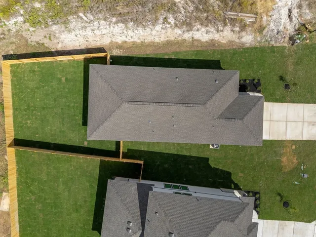 an aerial view of a house having yard