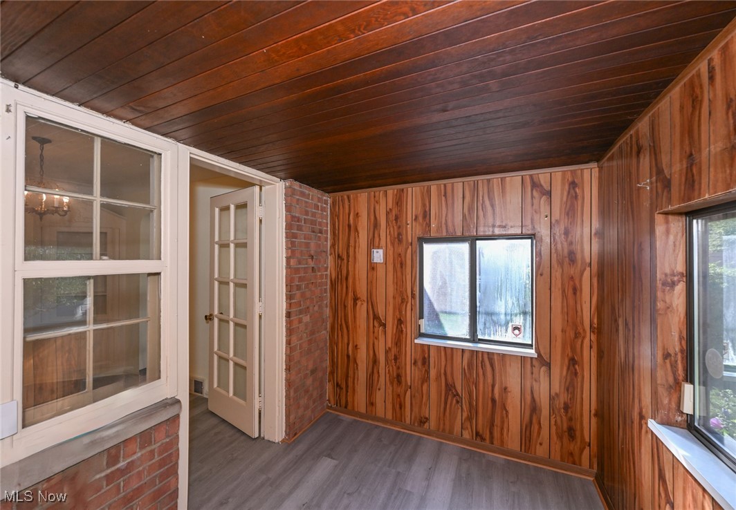4033 Wyncote Road South Euclid, OH 44121 - Photo 17 of 25 Spare room featuring wooden ceiling, hardwood / wood-style floors, and wood walls