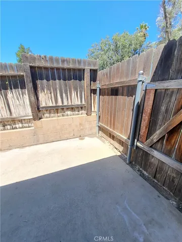 a view of small space with wooden fence