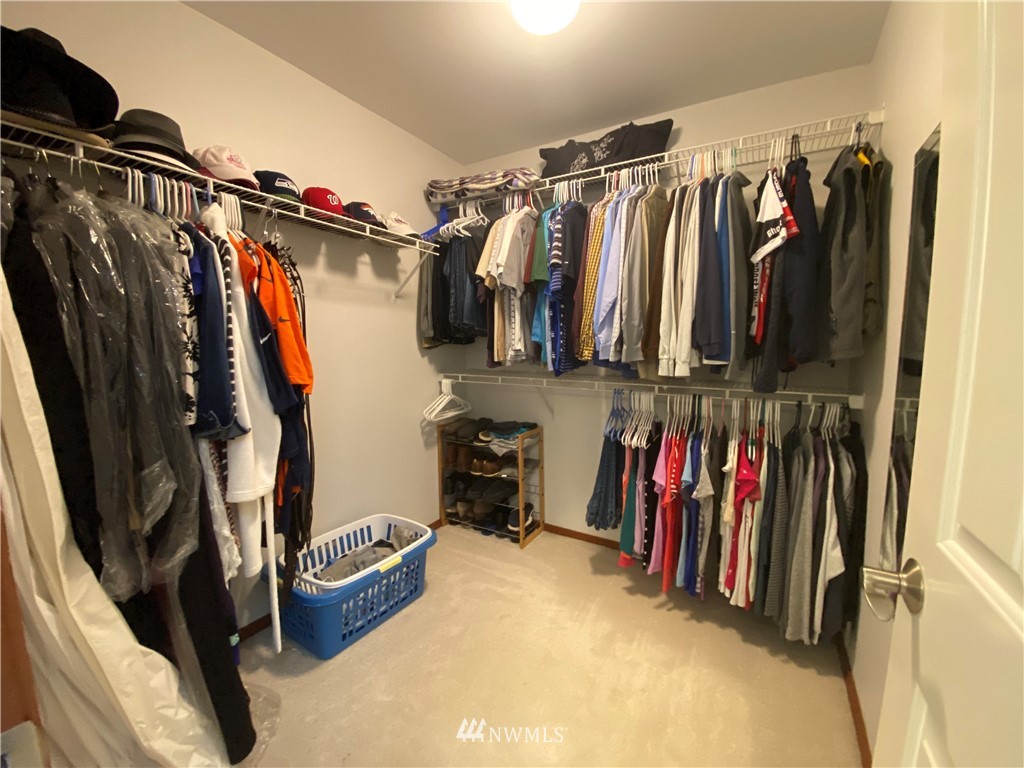 1815 Northeast 27th Court Renton, WA 98056 - Photo 17 of 31 a view of walk in closet with clothes and shoes