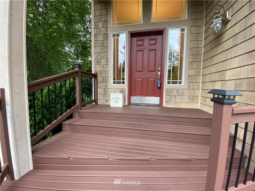 1815 Northeast 27th Court Renton, WA 98056 - Photo 3 of 31 a view of a balcony with wooden floor