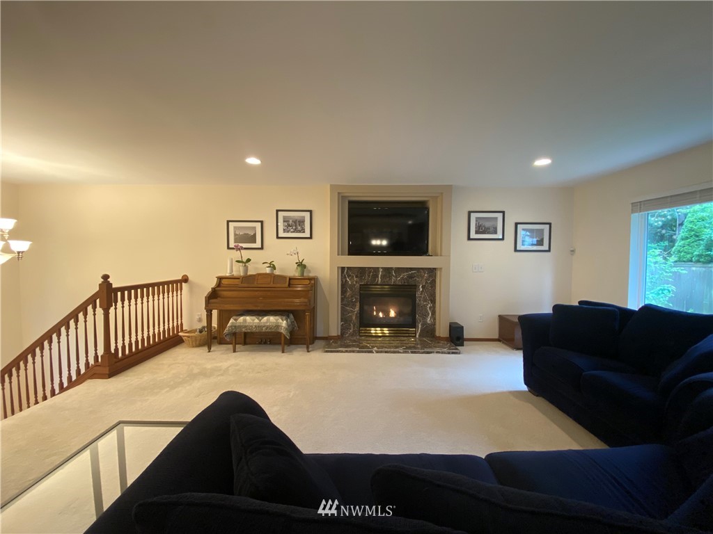 1815 Northeast 27th Court Renton, WA 98056 - Photo 5 of 31 a living room with furniture fireplace and a flat screen tv
