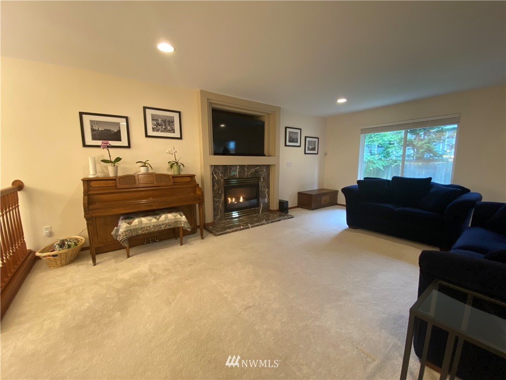 1815 Northeast 27th Court Renton, WA 98056 - Photo 6 of 31 a view of a livingroom with furniture and a flat screen tv